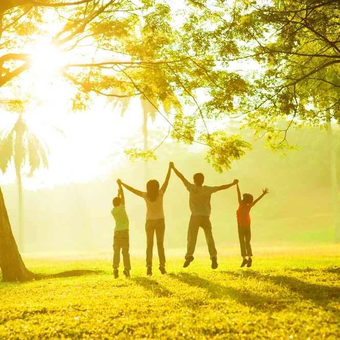 Happy family underneath a tree